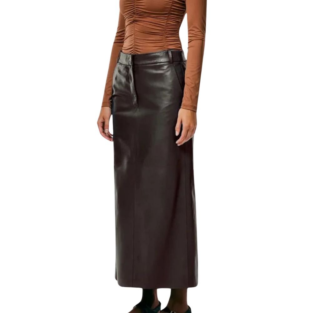 Woman posing in a brown leather skirt