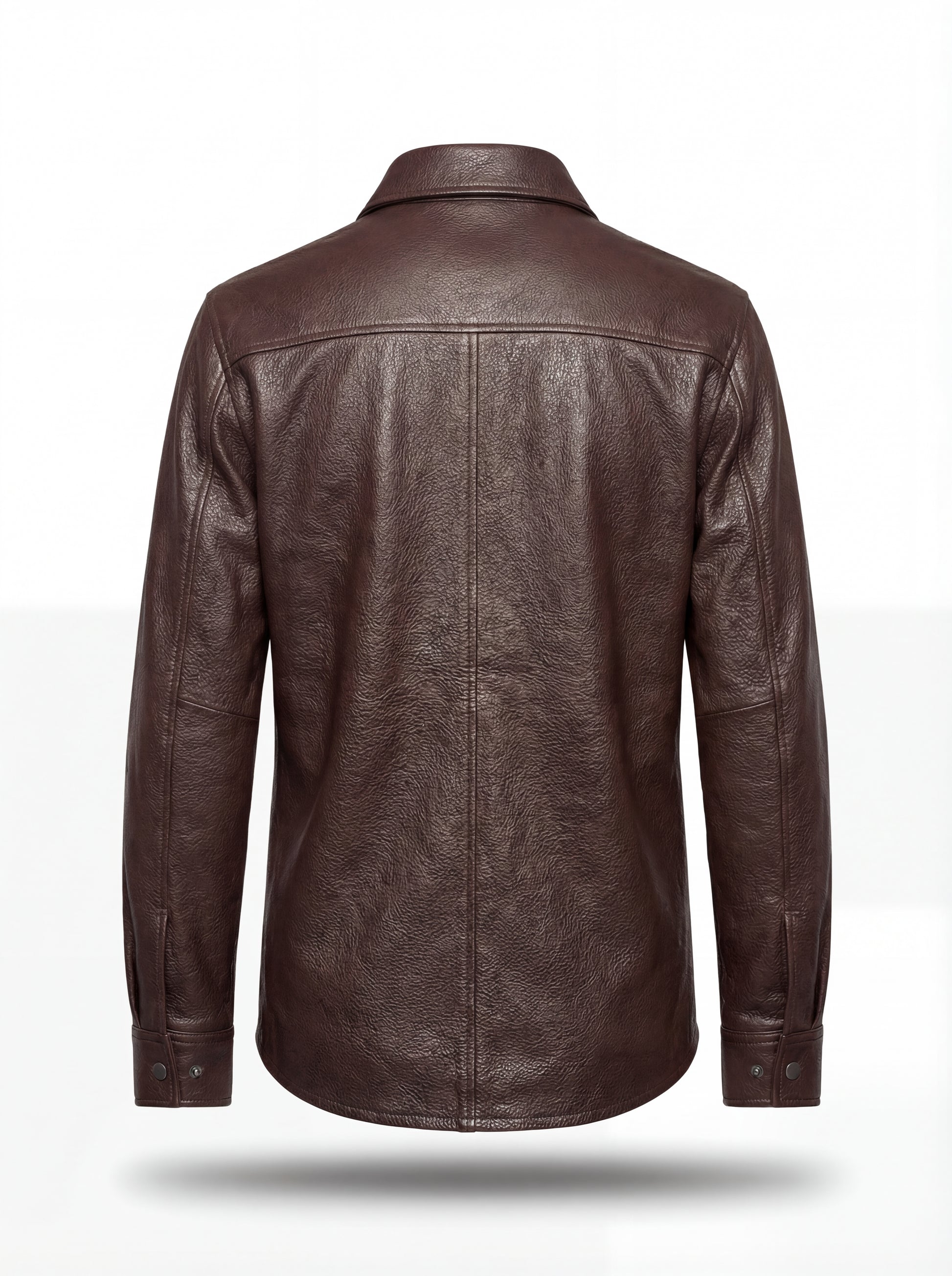 Rear view of dark brown leather overshirt showing vertical center seam and structured back yoke. The Garrison by Maverick Jacket.