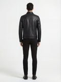 Rear view of male model wearing Maverick Spencer leather zip-front shirt showing tailored shoulder fit and straight hem styling. Maverick Jacket.