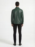 Rear view of male model wearing Maverick Cillian green leather western shirt showing tailored shoulder fit and western yoke styling. Maverick Jacket.