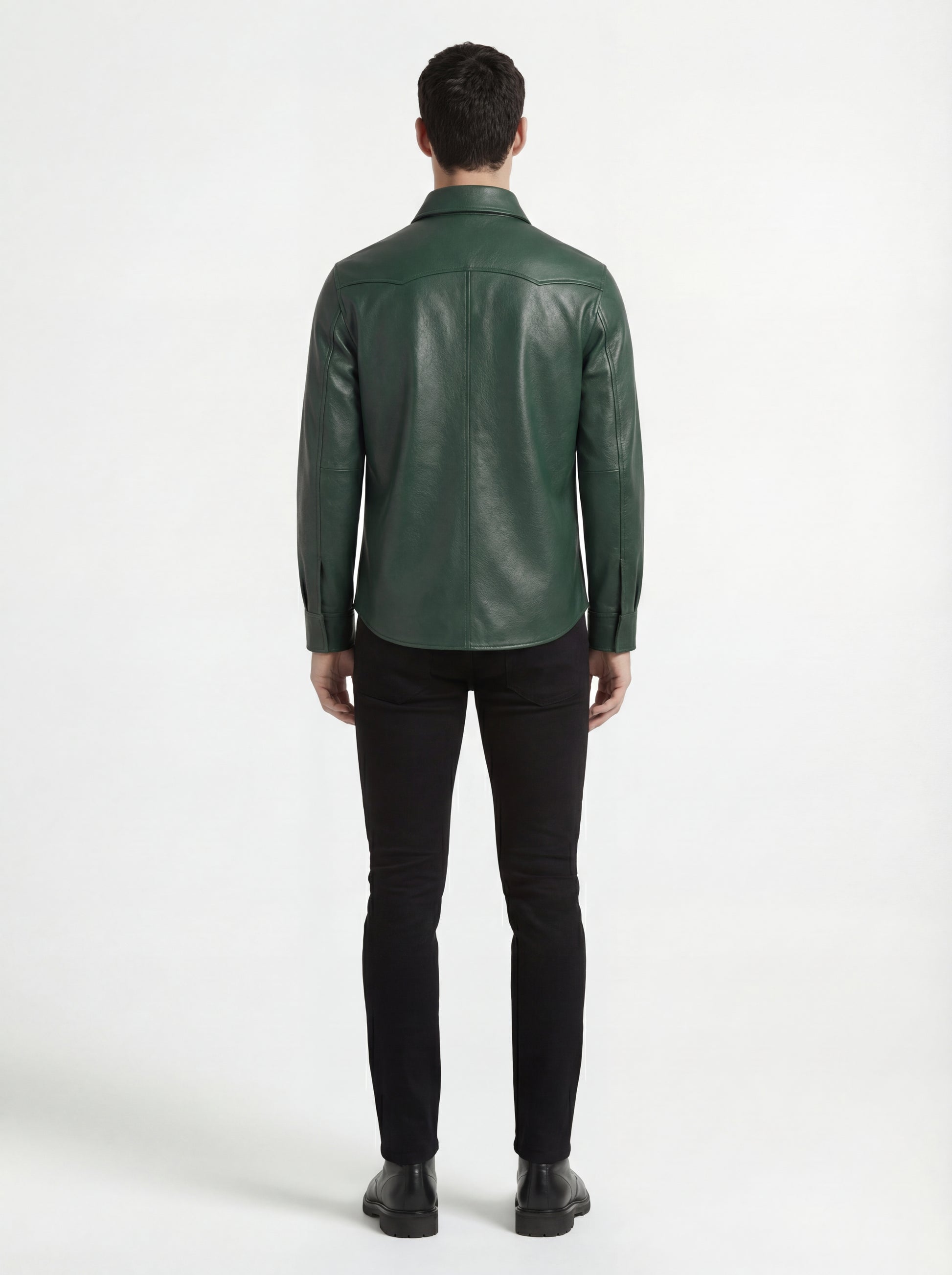 Rear view of male model wearing Maverick Cillian green leather western shirt showing tailored shoulder fit and western yoke styling. Maverick Jacket.