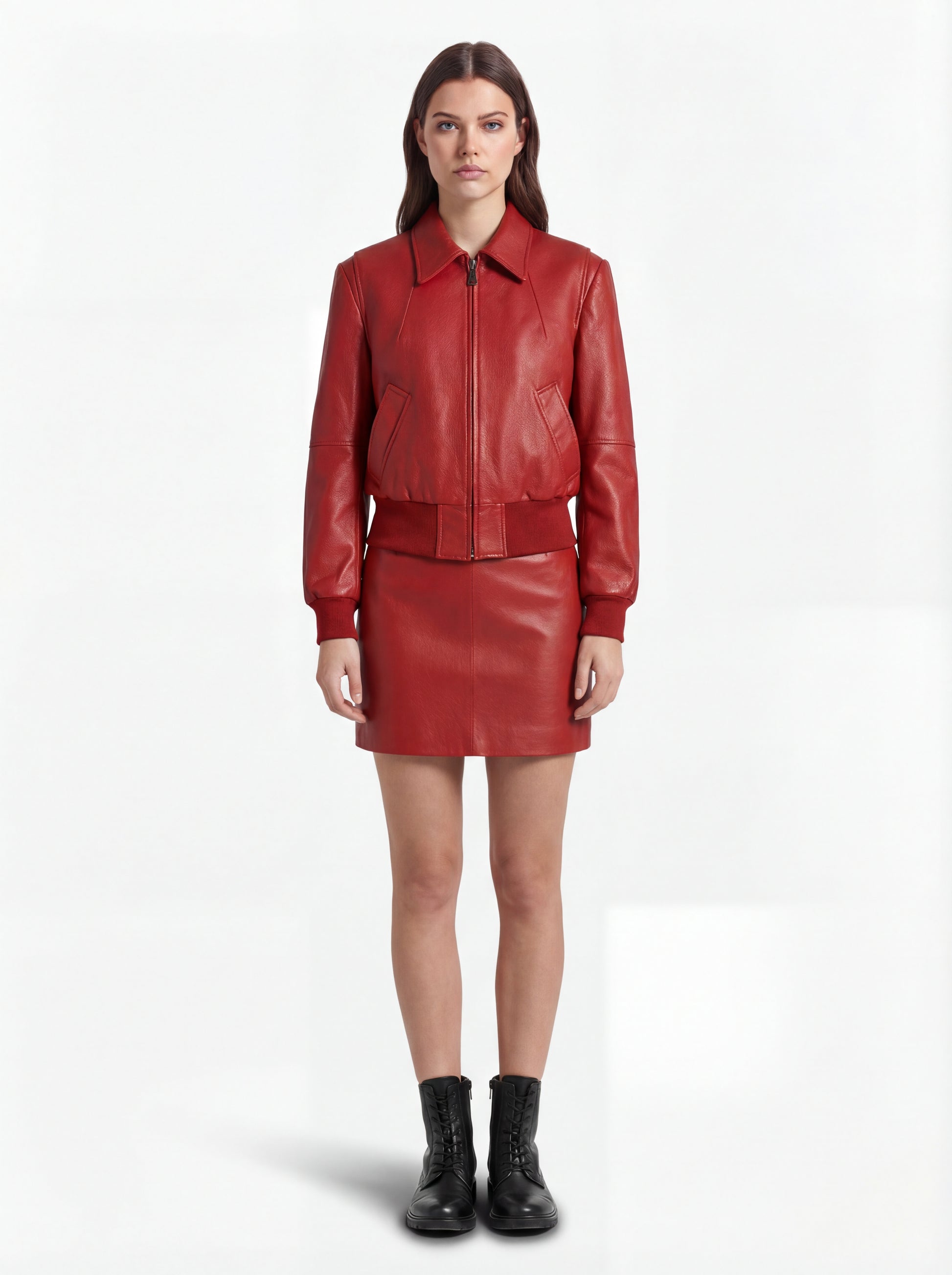 Female model wearing Maverick Isla leather bomber jacket, relaxed fit, styled with Maverick Orla red leather mini skirt. Maverick Jacket.