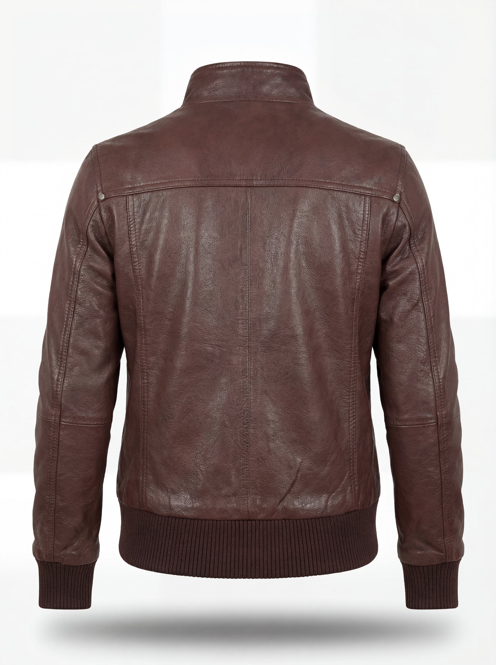 Rear view of brown leather bomber jacket showing ribbed waist hem and structured yoke paneling. The Sienna by Maverick Jacket.