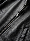 Macro shot of pebbled black leather texture and silver metal zipper puller on bomber jacket. The Roxy by Maverick Jacket.