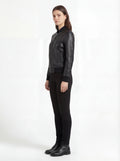 Side profile of Maverick Roxy bomber jacket showing ribbed cuff sleeve detail and cropped waist silhouette. Maverick Jacket.