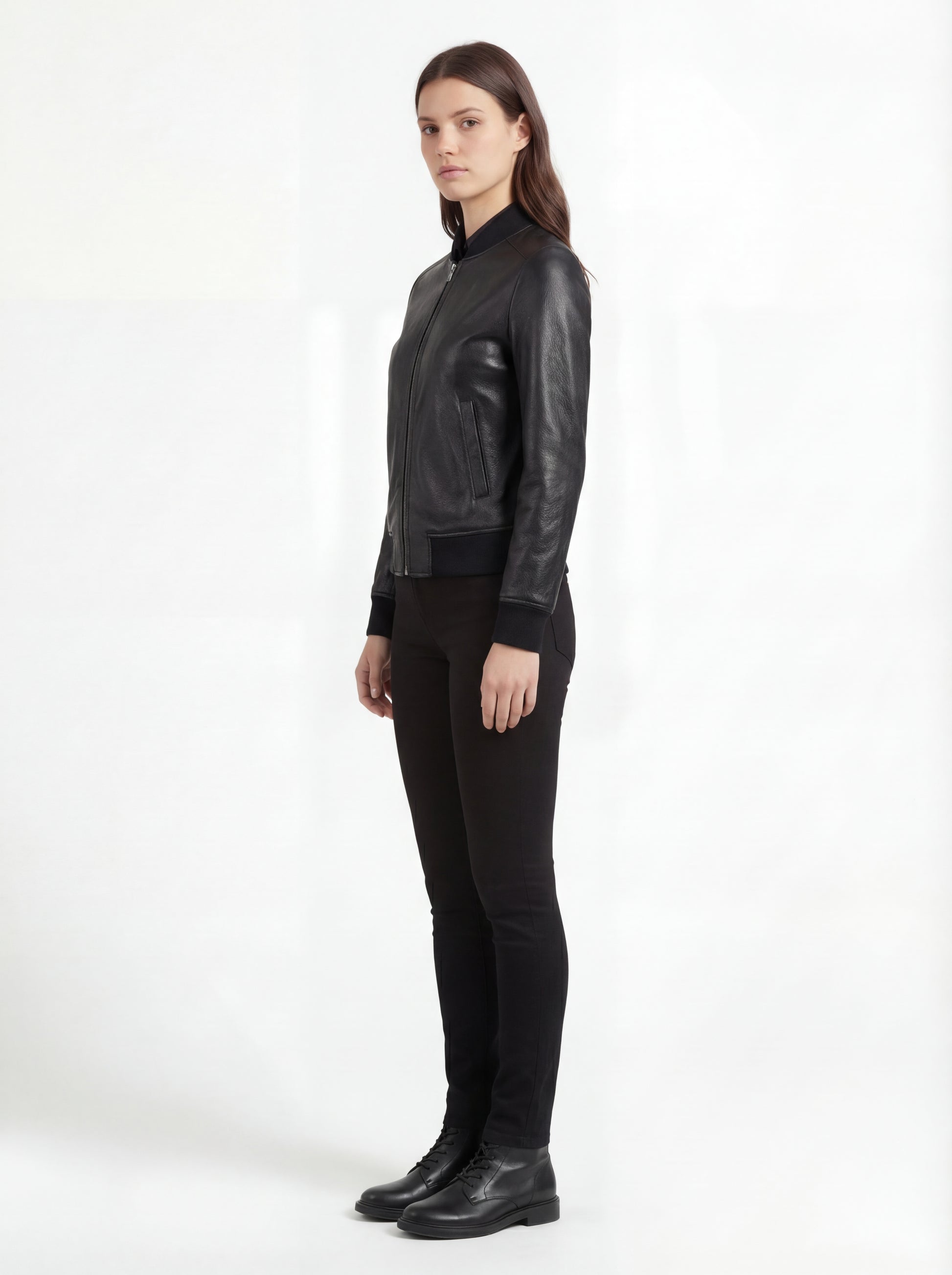 Side profile of Maverick Roxy bomber jacket showing ribbed cuff sleeve detail and cropped waist silhouette. Maverick Jacket.