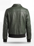 Rear view of green pebbled leather bomber jacket showing central vertical seam and ribbed hem. The Verdant by Maverick Jacket.