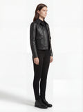 Side profile of Maverick Matrix black trucker jacket showing set-in sleeve structure and straight silhouette. Maverick Jacket.