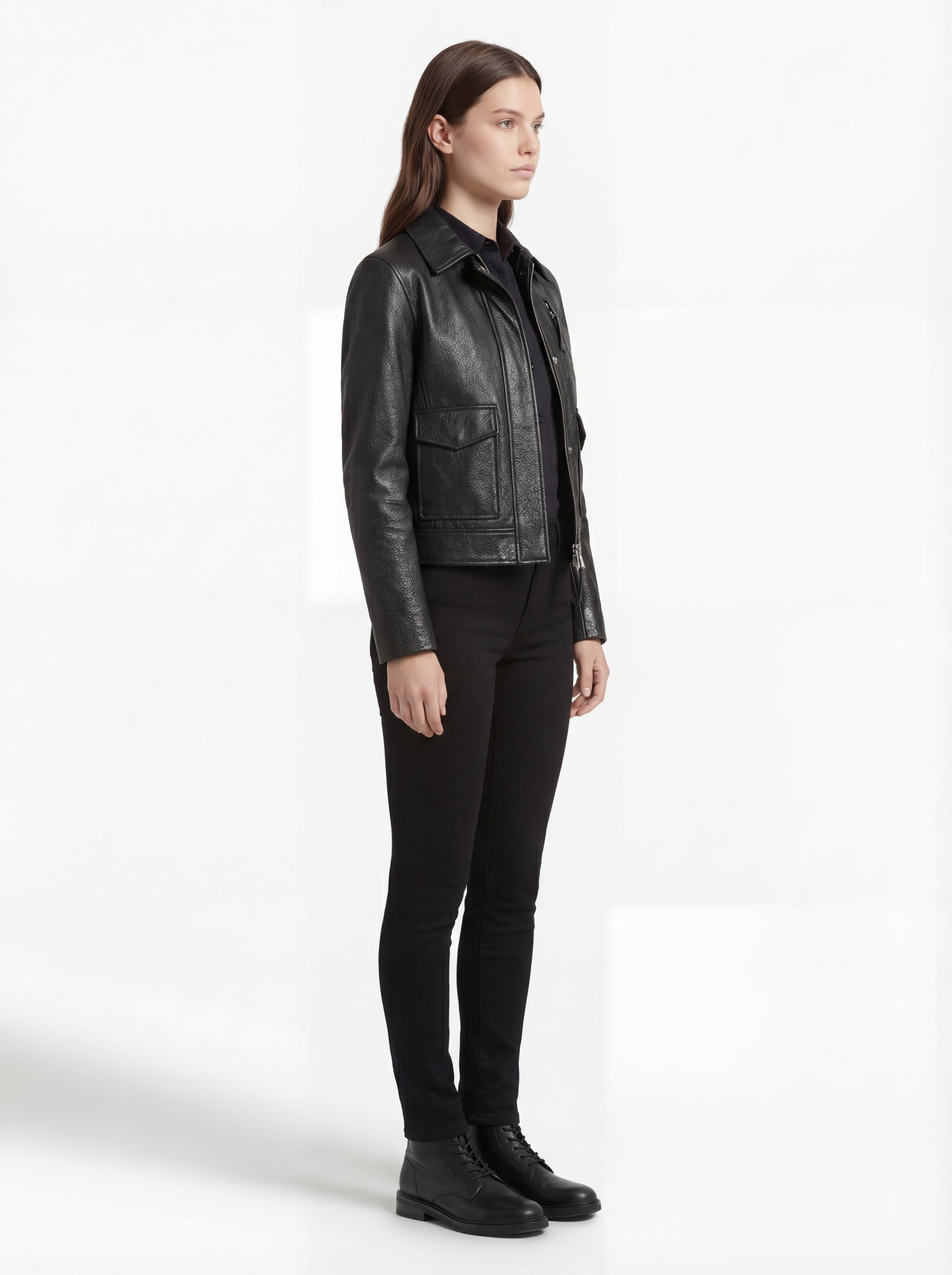 Side profile of Maverick Matrix black trucker jacket showing set-in sleeve structure and straight silhouette. Maverick Jacket.