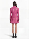 Rear view of female model wearing Maverick Cleo leather biker jacket showing structured shoulder fit and quilted panel construction. Maverick Jacket.