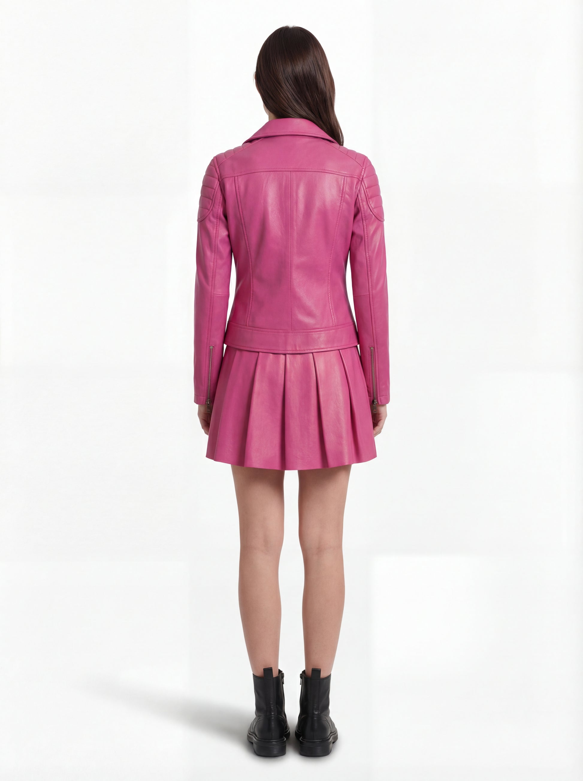 Rear view of female model wearing Maverick Cleo leather biker jacket showing structured shoulder fit and quilted panel construction. Maverick Jacket.