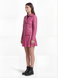 Side profile of Maverick Cleo biker jacket showing zippered sleeve cuffs and cropped waist silhouette. Maverick Jacket.