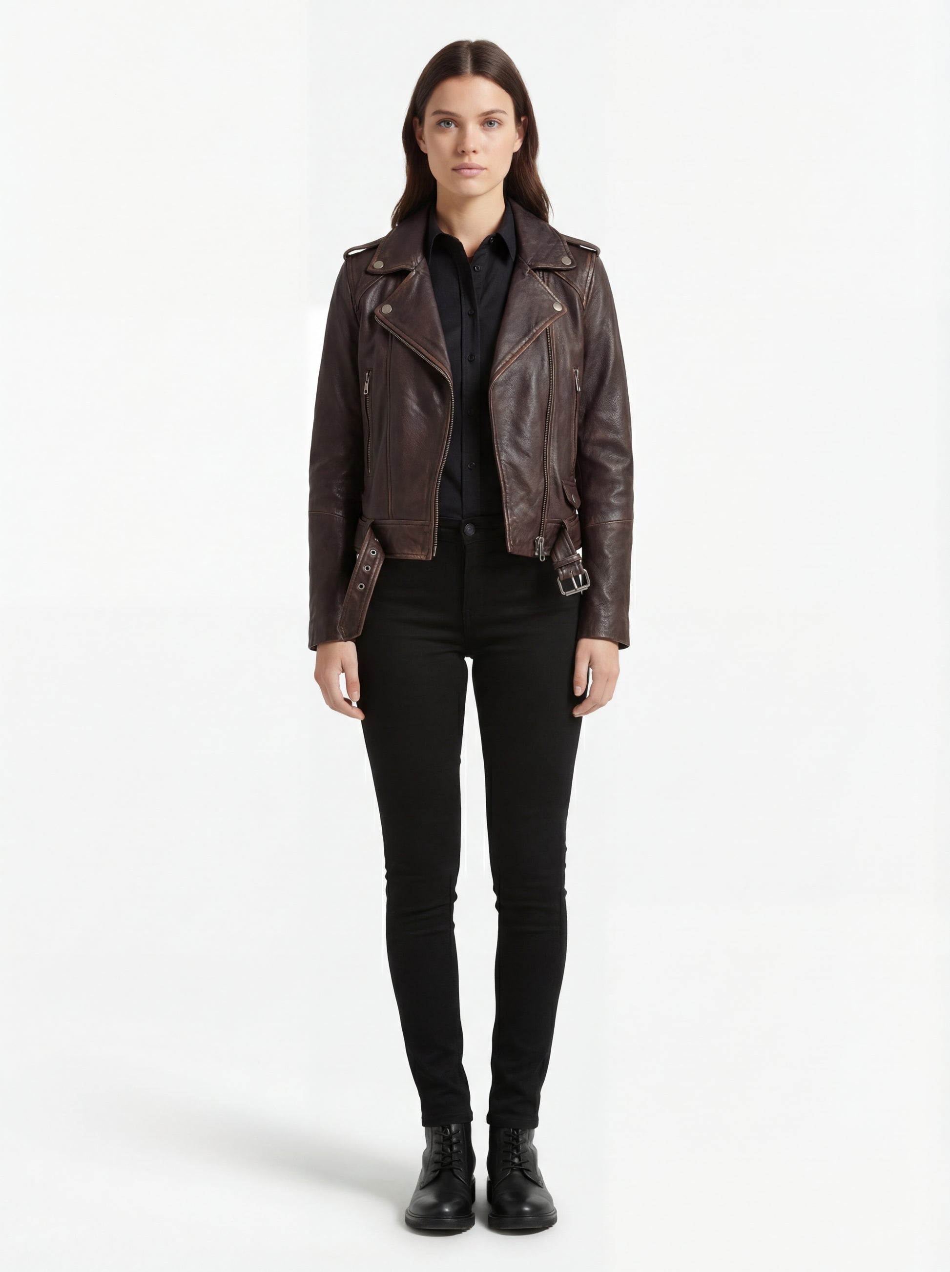 Female model wearing Maverick Zephyr distressed brown biker jacket, regular fit, styled with black button-down shirt and black skinny jeans. Maverick Jacket.