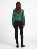 Rear view of female model wearing Maverick Jade emerald green biker jacket showing tailored shoulder fit and cropped hem styling. Maverick Jacket.
