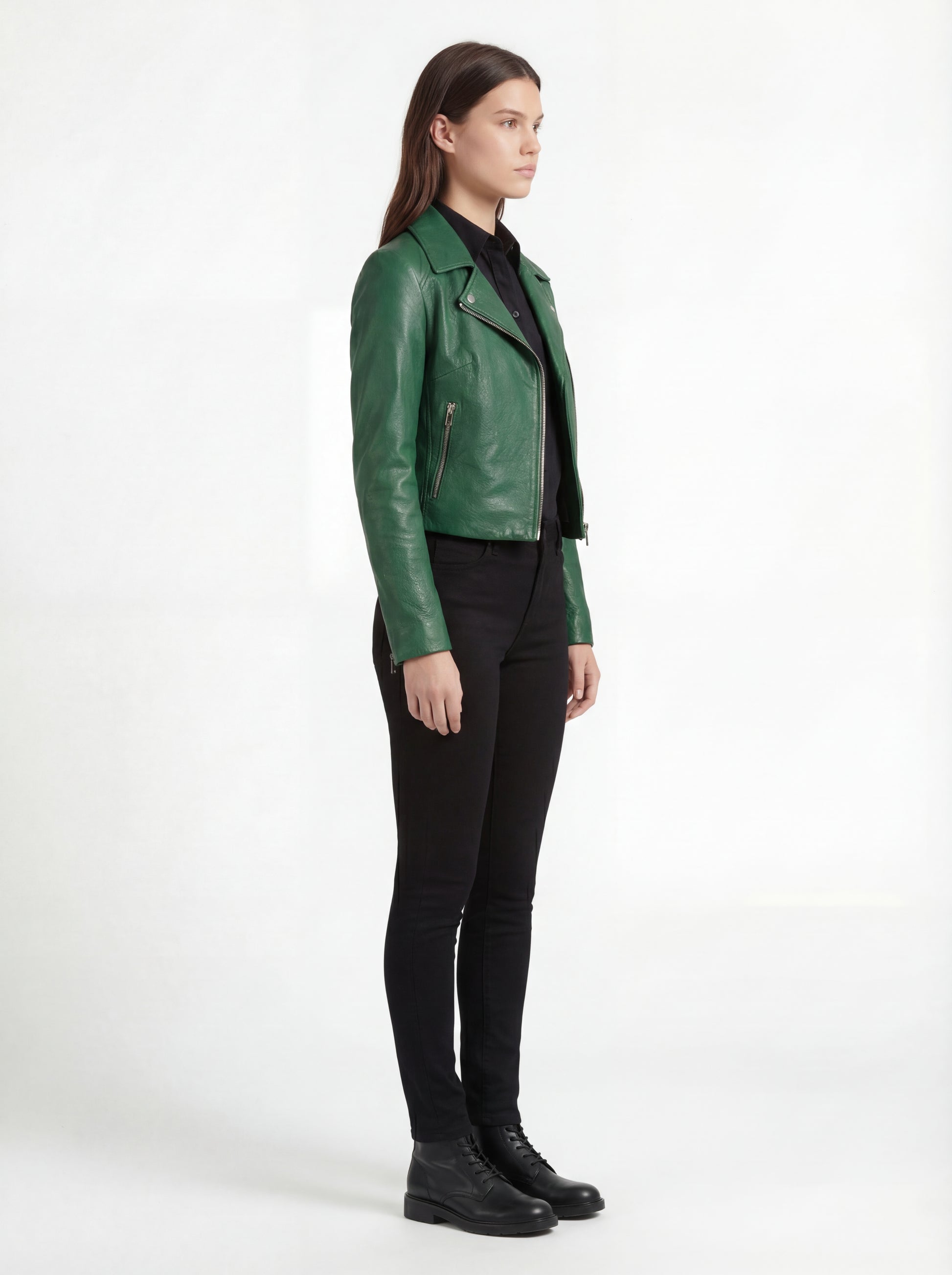 Side profile of Maverick Jade emerald green biker jacket showing zippered sleeve cuffs and fitted silhouette. Maverick Jacket.