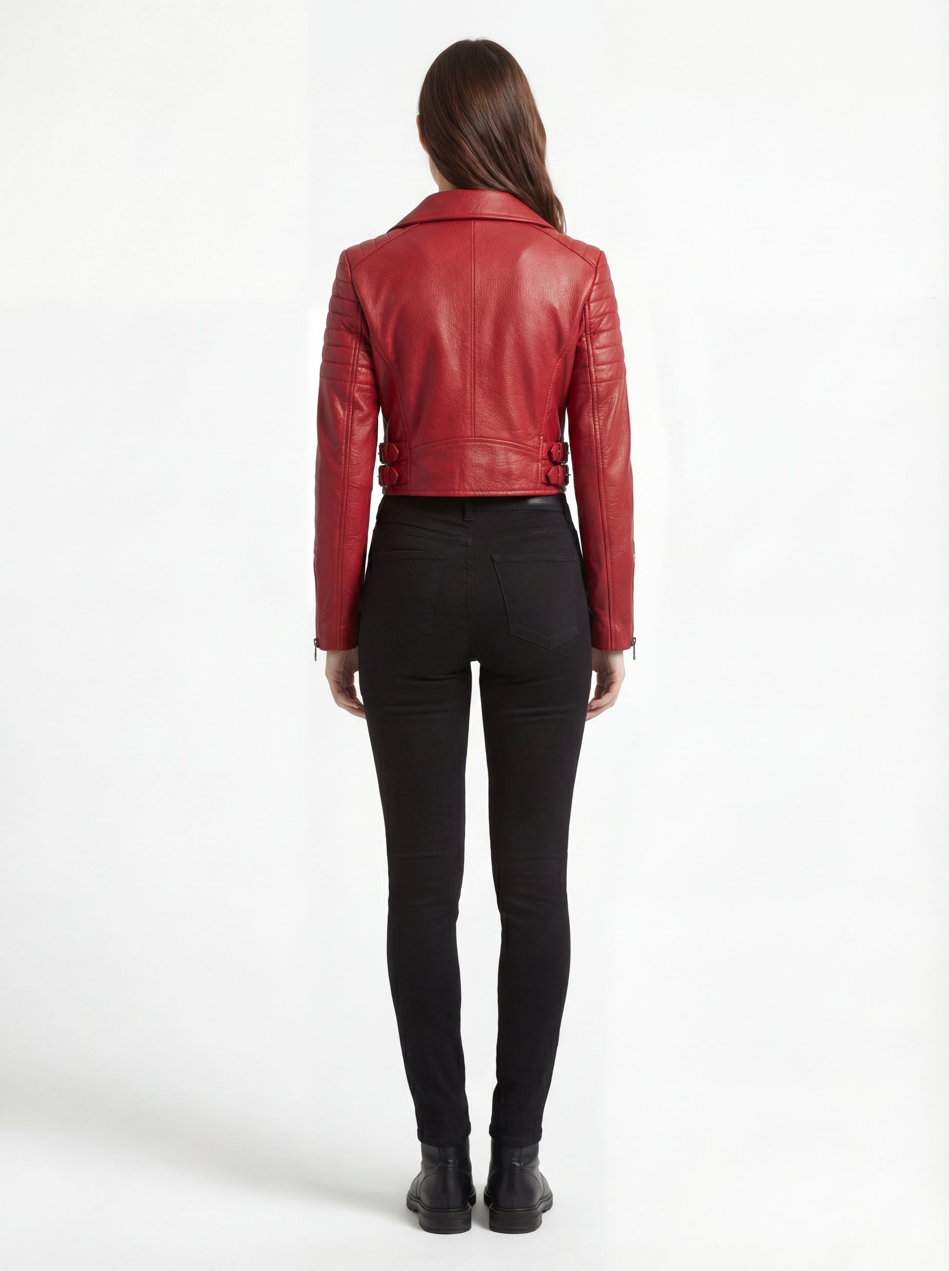 Rear view of female model wearing Maverick Vixen red biker jacket showing structured shoulder fit and cropped hem styling. Maverick Jacket.
