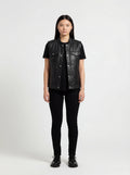 Female model wearing Maverick Oakley leather vest, relaxed fit, styled with black t-shirt and black skinny jeans. Maverick Jacket.
