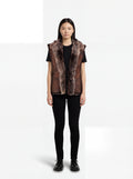 Female model wearing Maverick Freya leather vest, relaxed fit, styled with black t-shirt and black skinny jeans. Maverick Jacket.
