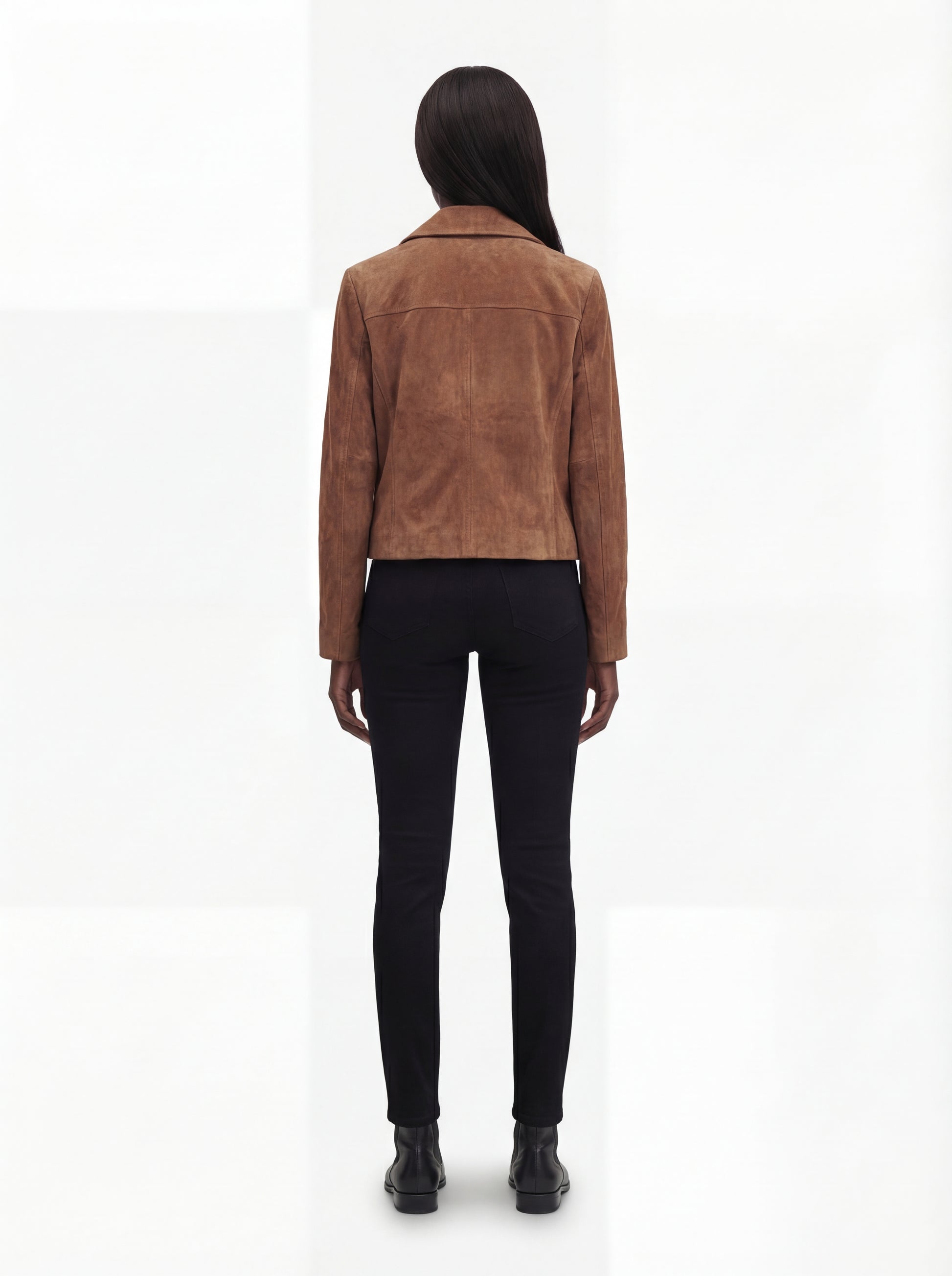 Rear view of female model wearing Maverick Montana suede jacket showing structured shoulder fit and clean back styling. Maverick Jacket.