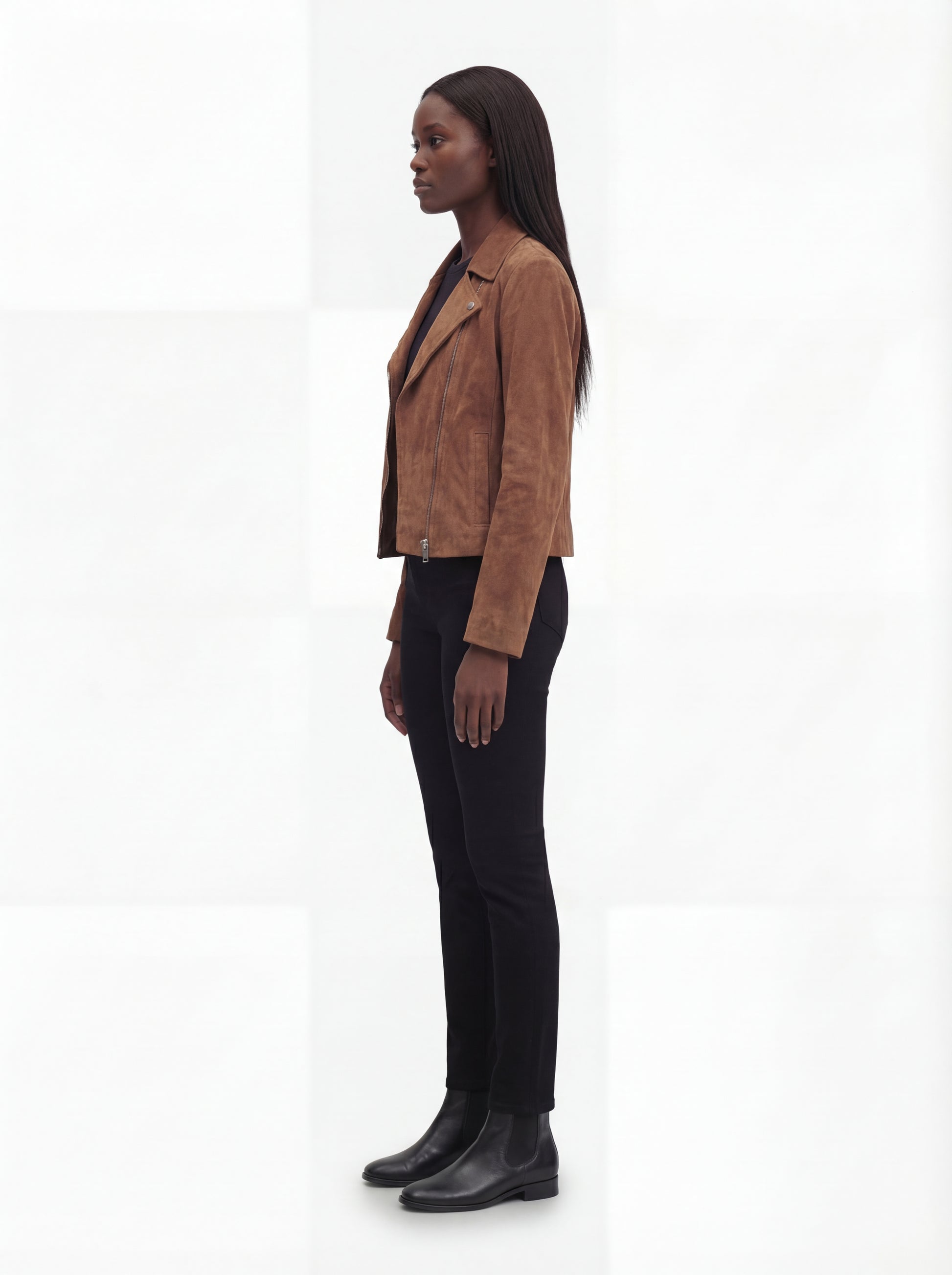 Side profile of Maverick Montana suede jacket showing long sleeve structure and tailored hip-length silhouette. Maverick Jacket.