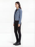 Side profile of Maverick Azure suede biker jacket showing zippered sleeve cuffs and cropped silhouette. Maverick Jacket.