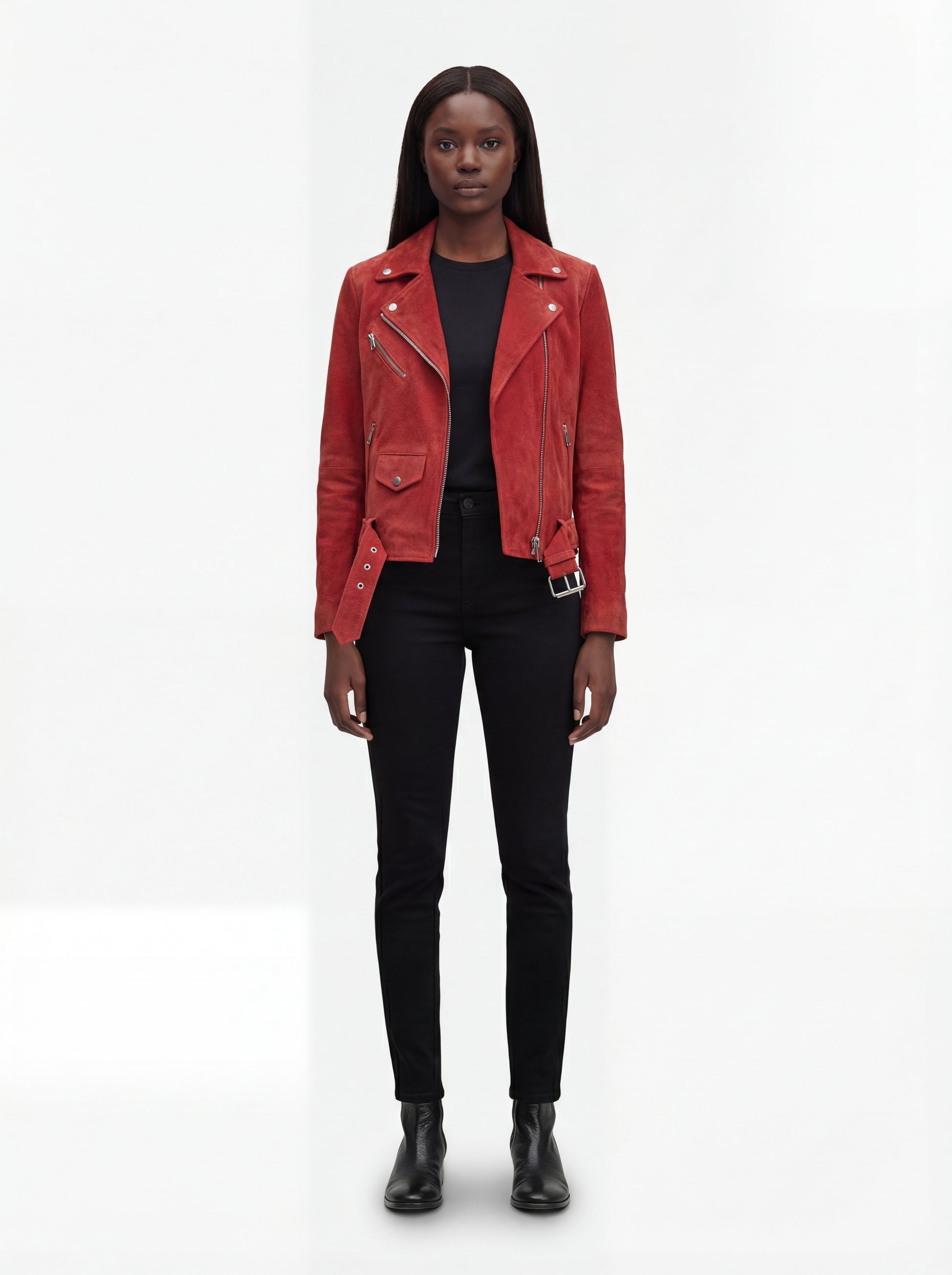 Female model wearing Maverick Ember suede jacket, open fit, styled with black skinny jeans and black leather boots. Maverick Jacket.