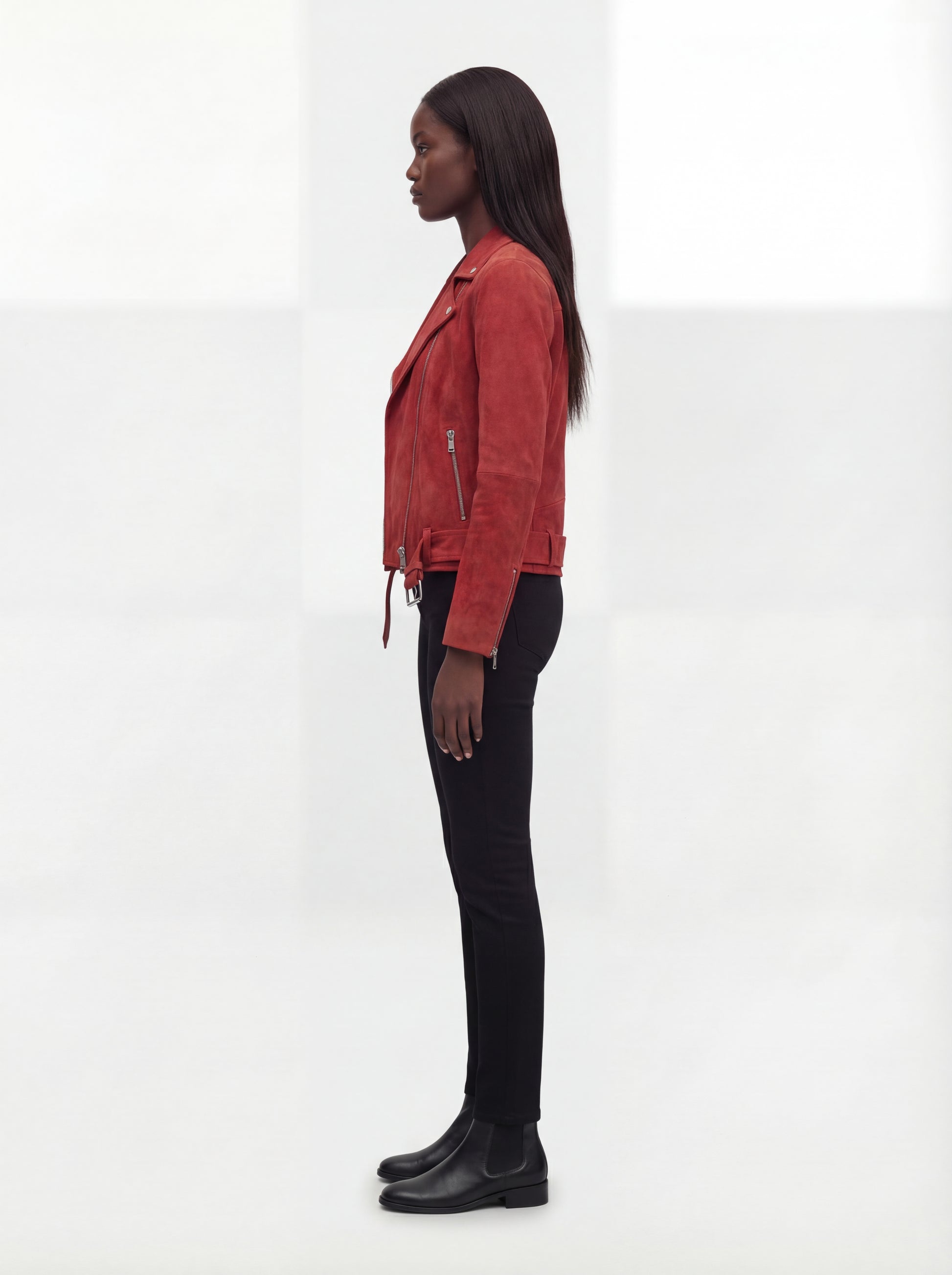 Side profile of Maverick Ember suede jacket showing zippered sleeve cuffs and slim cropped silhouette. Maverick Jacket.