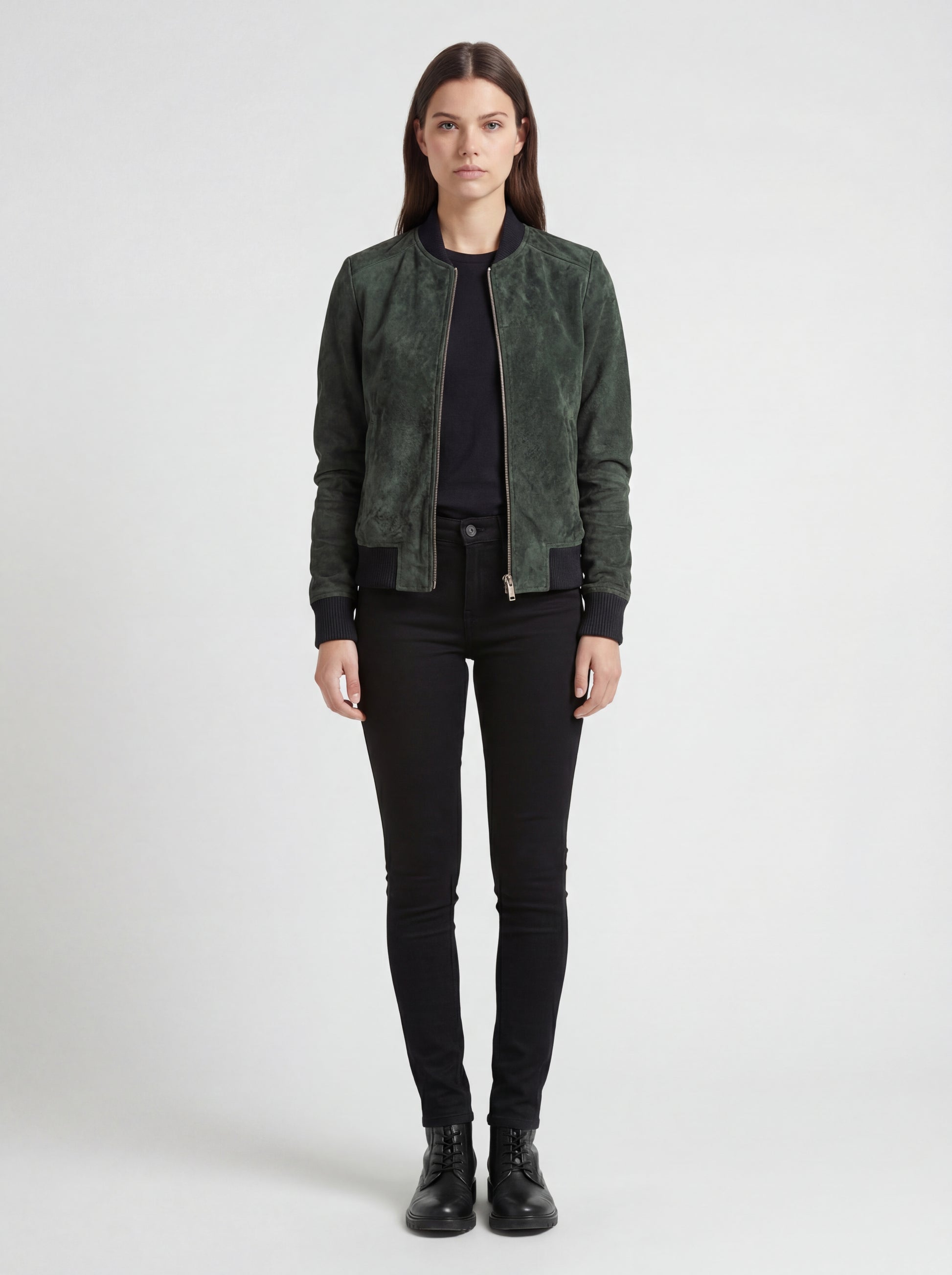 Female model wearing Maverick Willow suede bomber jacket, regular fit, styled with black skinny jeans and leather boots. Maverick Jacket.