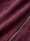 Macro shot of soft plum purple suede texture and heavy-duty silver zipper hardware on biker jacket. The Amethyst by Maverick Jacket.