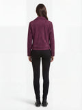 Rear view of female model wearing Maverick Amethyst suede biker jacket showing fitted shoulder structure and clean back styling. Maverick Jacket.