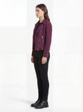 Side profile of Maverick Amethyst suede biker jacket showing zippered sleeve cuffs and cropped silhouette. Maverick Jacket.