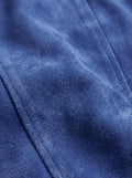 Macro shot of soft royal blue suede texture and heavy-duty silver zipper hardware on biker jacket. The Sapphire by Maverick Jacket.
