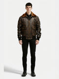 Male model wearing Maverick Corsair aviator jacket, classic bomber fit, styled with black button-down shirt and black skinny jeans. Maverick Jacket.