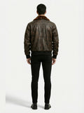 Rear view of male model wearing Maverick Corsair aviator jacket showing broad shoulder fit and ribbed hem styling. Maverick Jacket.
