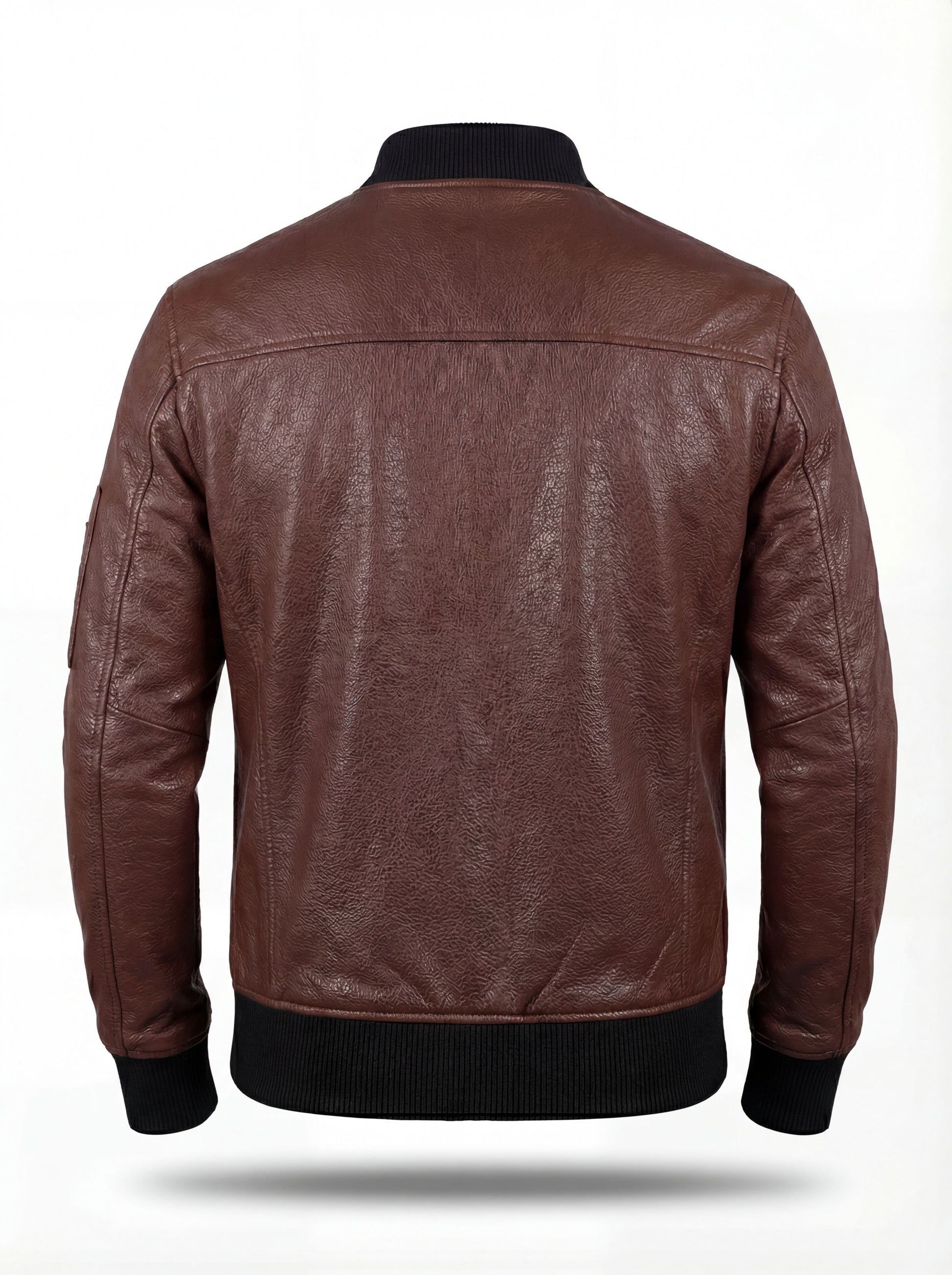 Rear view of brown leather bomber jacket showing vertical center seam and black ribbed knit waistband. The Stratus by Maverick Jacket.