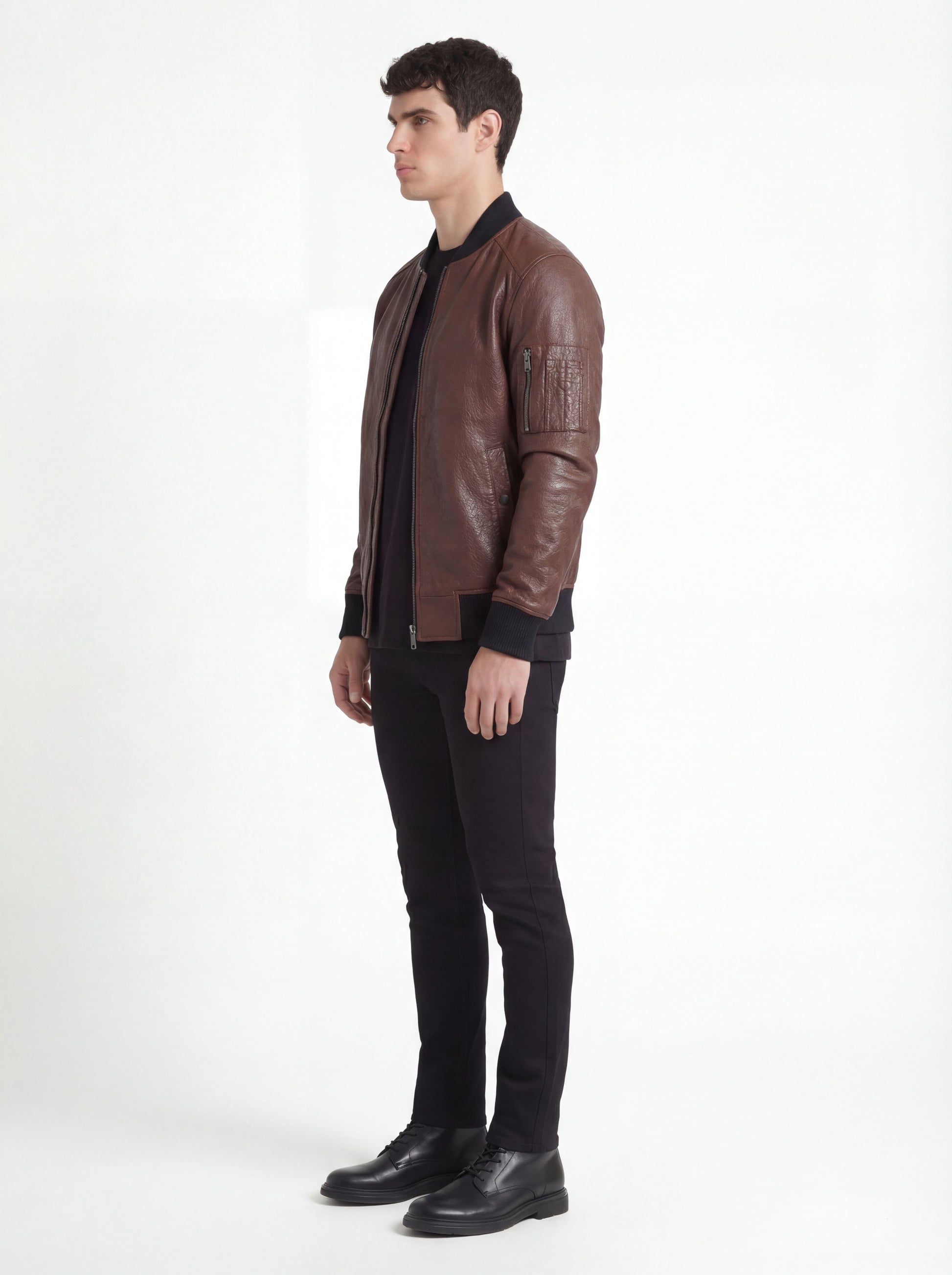 Side profile of Maverick Vector bomber jacket showing zippered sleeve utility pocket and straight torso fit. Maverick Jacket.