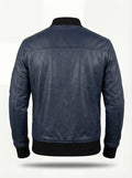 Rear view of navy blue leather MA-1 bomber jacket showing horizontal back yoke and black ribbed knit waistband. The Stratus by Maverick Jacket.