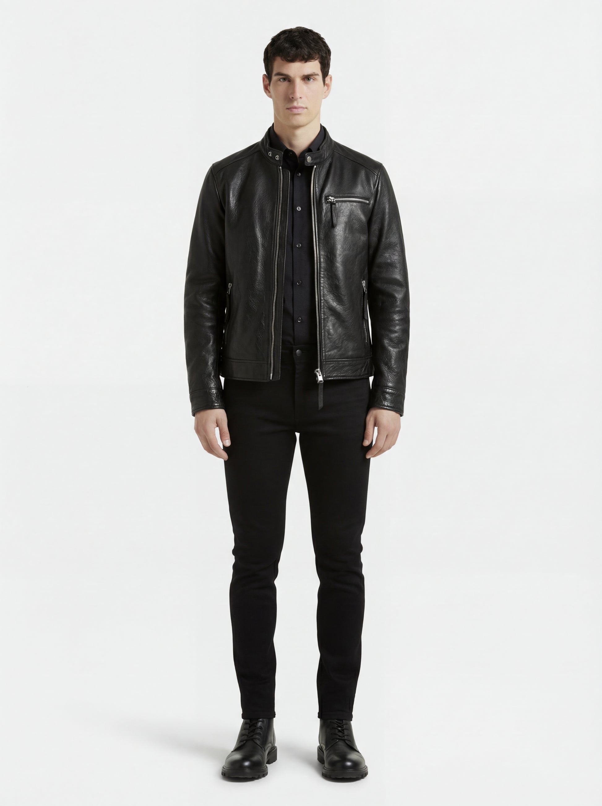 Male model wearing Maverick Zenith leather cafe racer, slim fit, styled with black button-up shirt and black skinny jeans. Maverick Jacket.