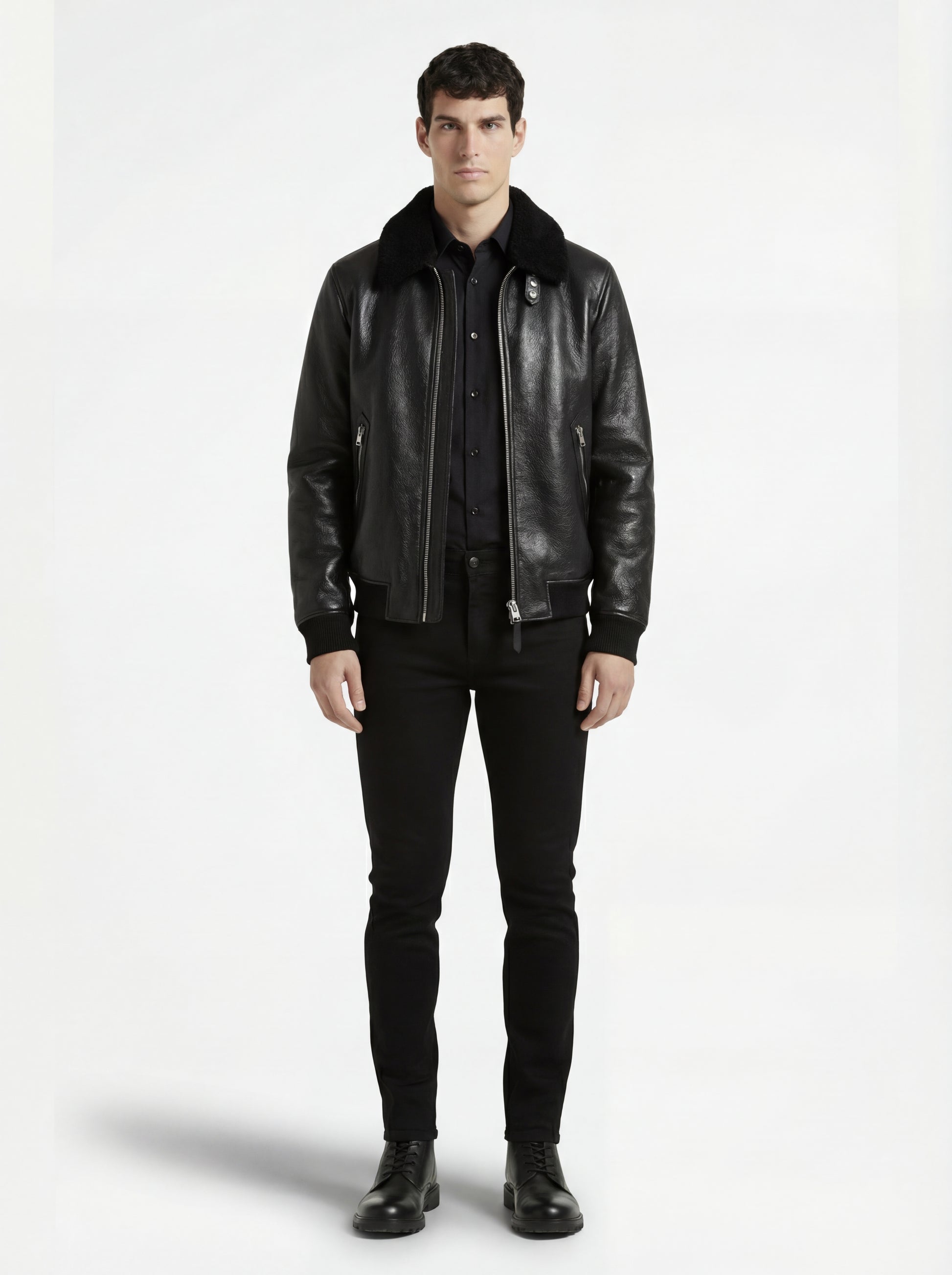 Male model wearing Maverick Phantom Black Leather Flight Jacket, regular fit, styled with black cargo trousers and combat boots. Maverick Jacket.