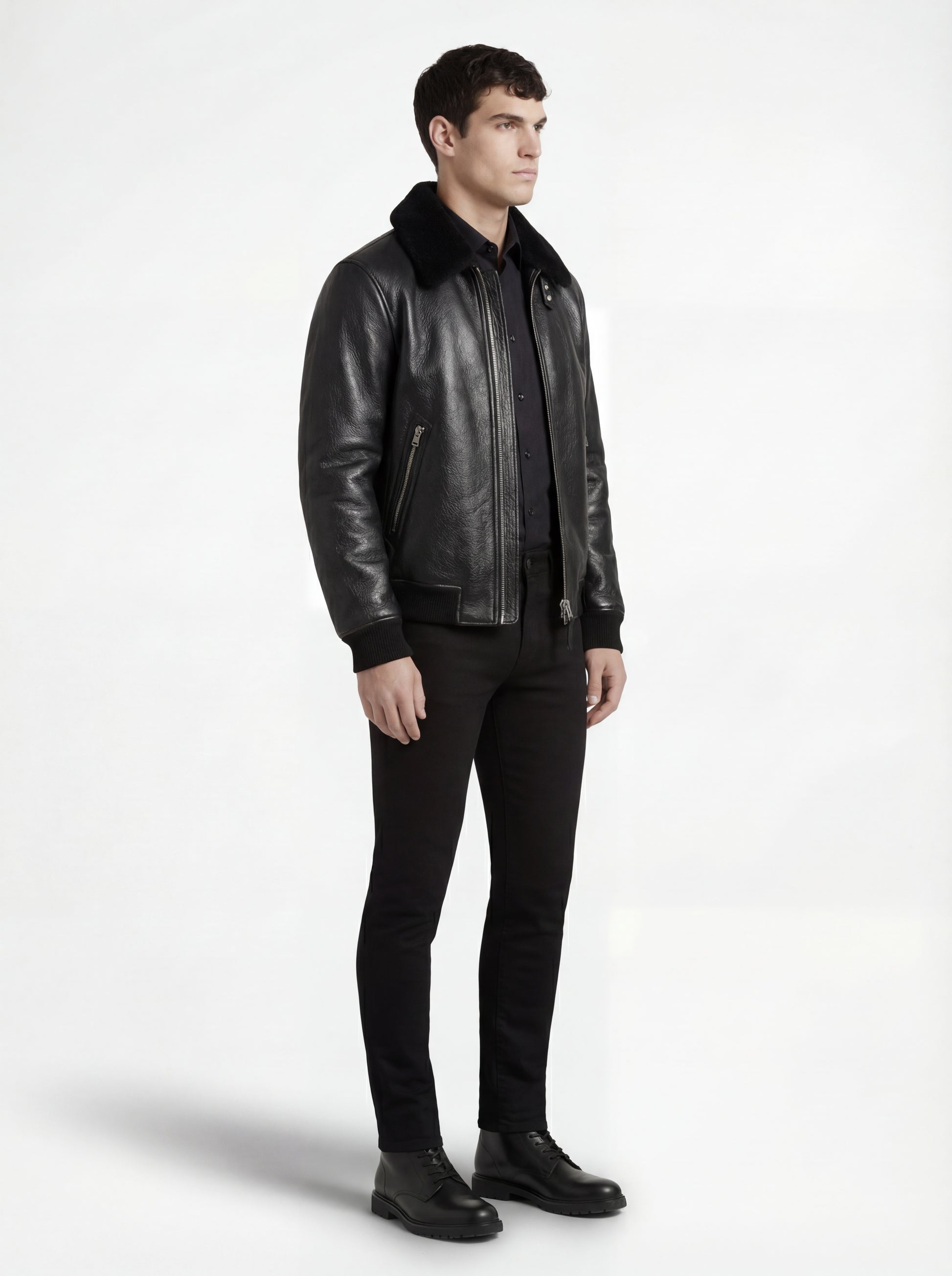 Side profile of Maverick Phantom Black Leather Flight Jacket showing zippered sleeve pocket and aviator silhouette. Maverick Jacket.