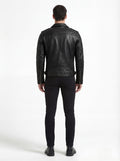 Rear view of male model wearing Maverick Night Rider biker jacket showing structured shoulder fit and ribbed sleeve detailing. Maverick Jacket.