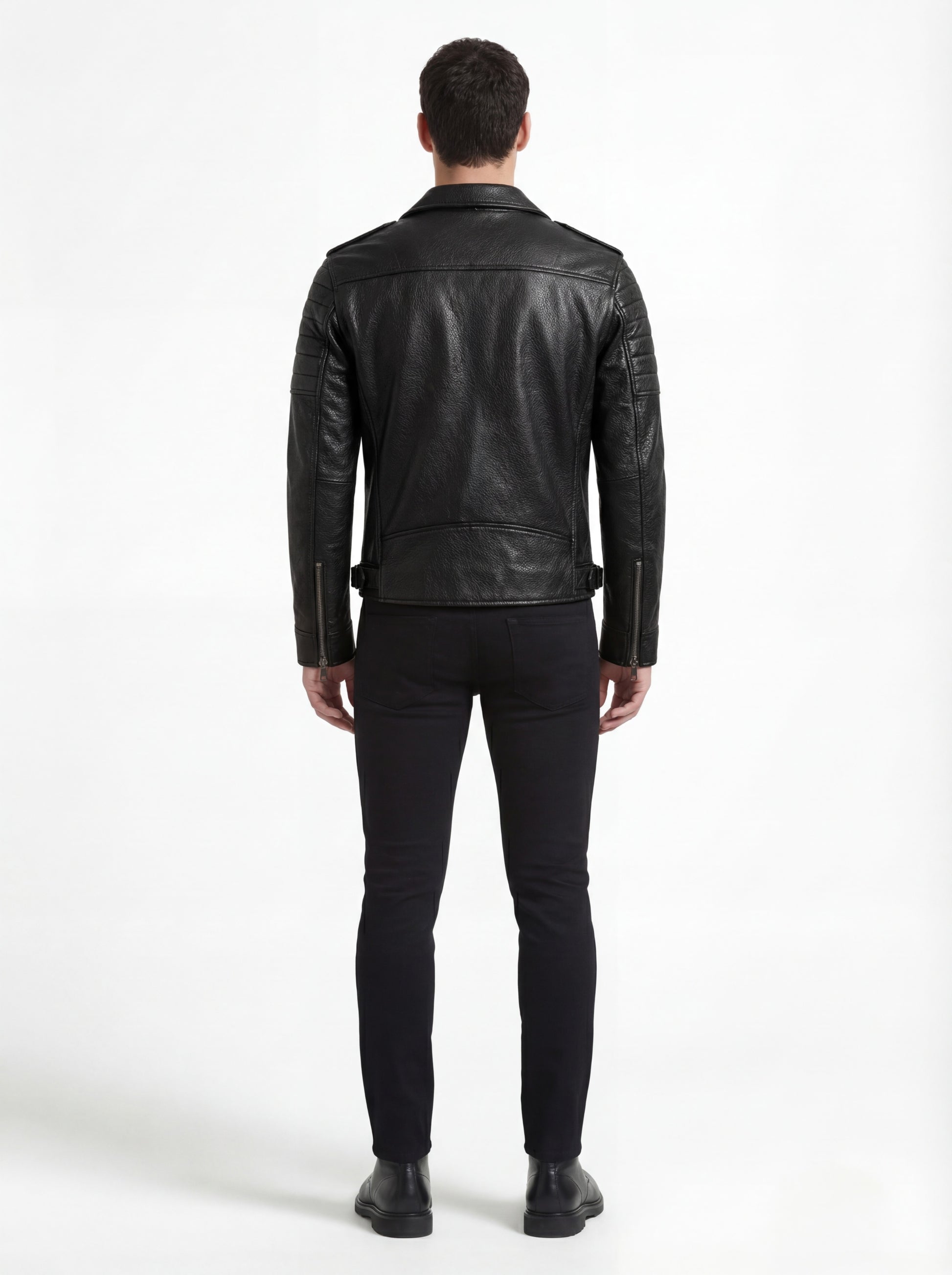Rear view of male model wearing Maverick Night Rider biker jacket showing structured shoulder fit and ribbed sleeve detailing. Maverick Jacket.