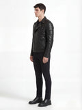 Side profile of Maverick Night Rider biker jacket showing quilted shoulder panels and tailored moto silhouette. Maverick Jacket.