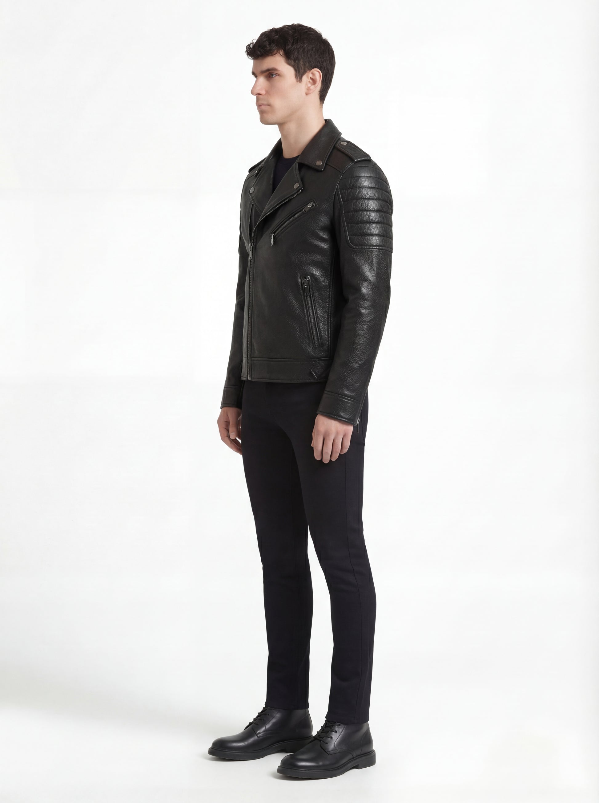 Side profile of Maverick Night Rider biker jacket showing quilted shoulder panels and tailored moto silhouette. Maverick Jacket.