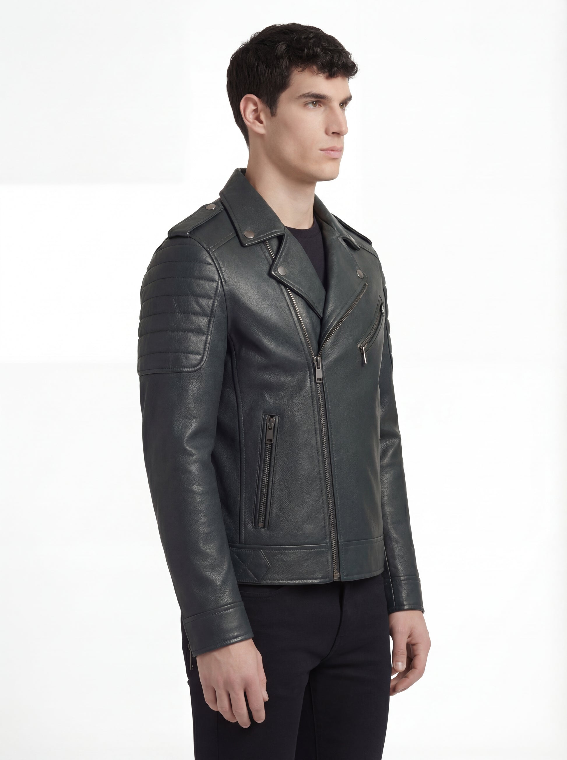 Side profile of Maverick Rogue biker jacket showing ribbed shoulder quilting and slim moto silhouette. Maverick Jacket.