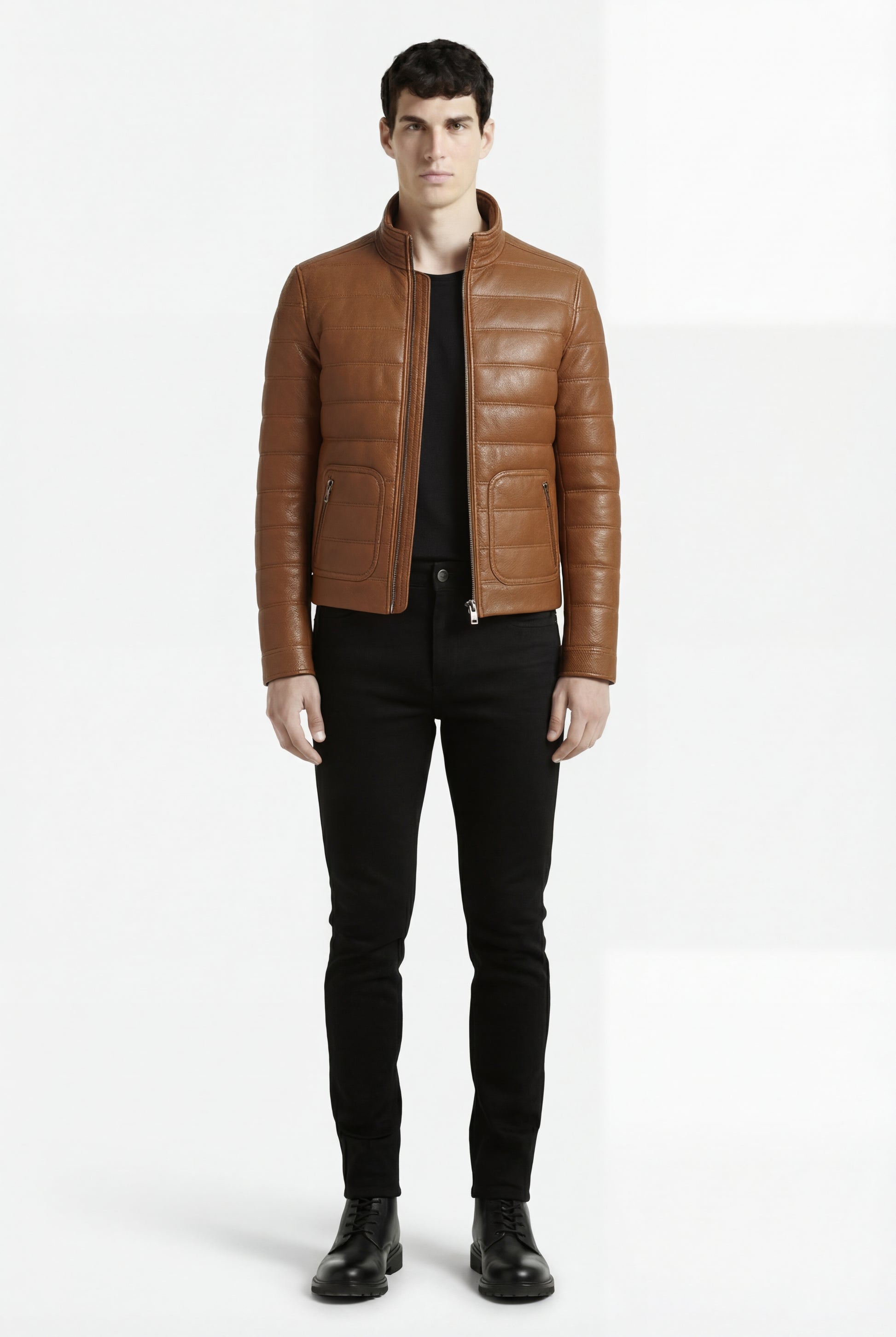 Male model wearing Maverick Terrano padded leather jacket, slim fit, styled with black crewneck t-shirt and black slim trousers. Maverick Jacket.