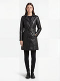 Female model wearing Maverick Kensington leather trench coat, tailored fit, styled with black skinny jeans and black leather boots. Maverick Kensington.