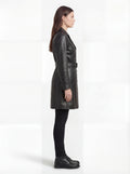 Side profile of Maverick Kensington trench coat showing long sleeve structure and mid-thigh length silhouette. Maverick Kensington.