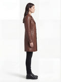 Side profile of Maverick York leather walker coat showing long sleeve structure and mid-thigh length silhouette. Maverick Jacket.