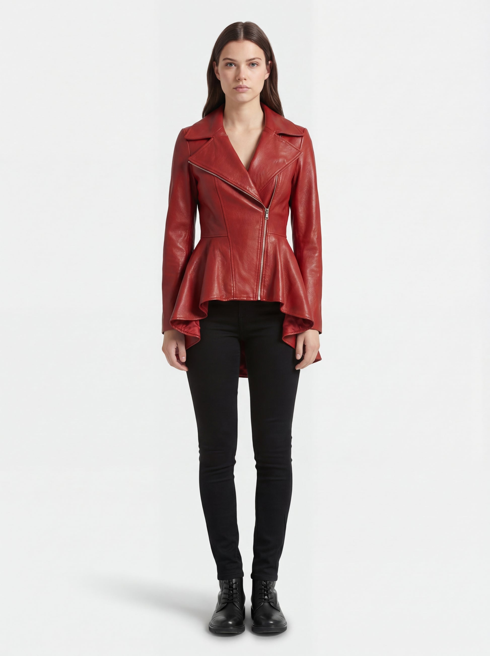 Female model wearing Maverick Valencia leather peplum coat, fitted silhouette, styled with black skinny jeans and black lace-up boots. Maverick Valencia.